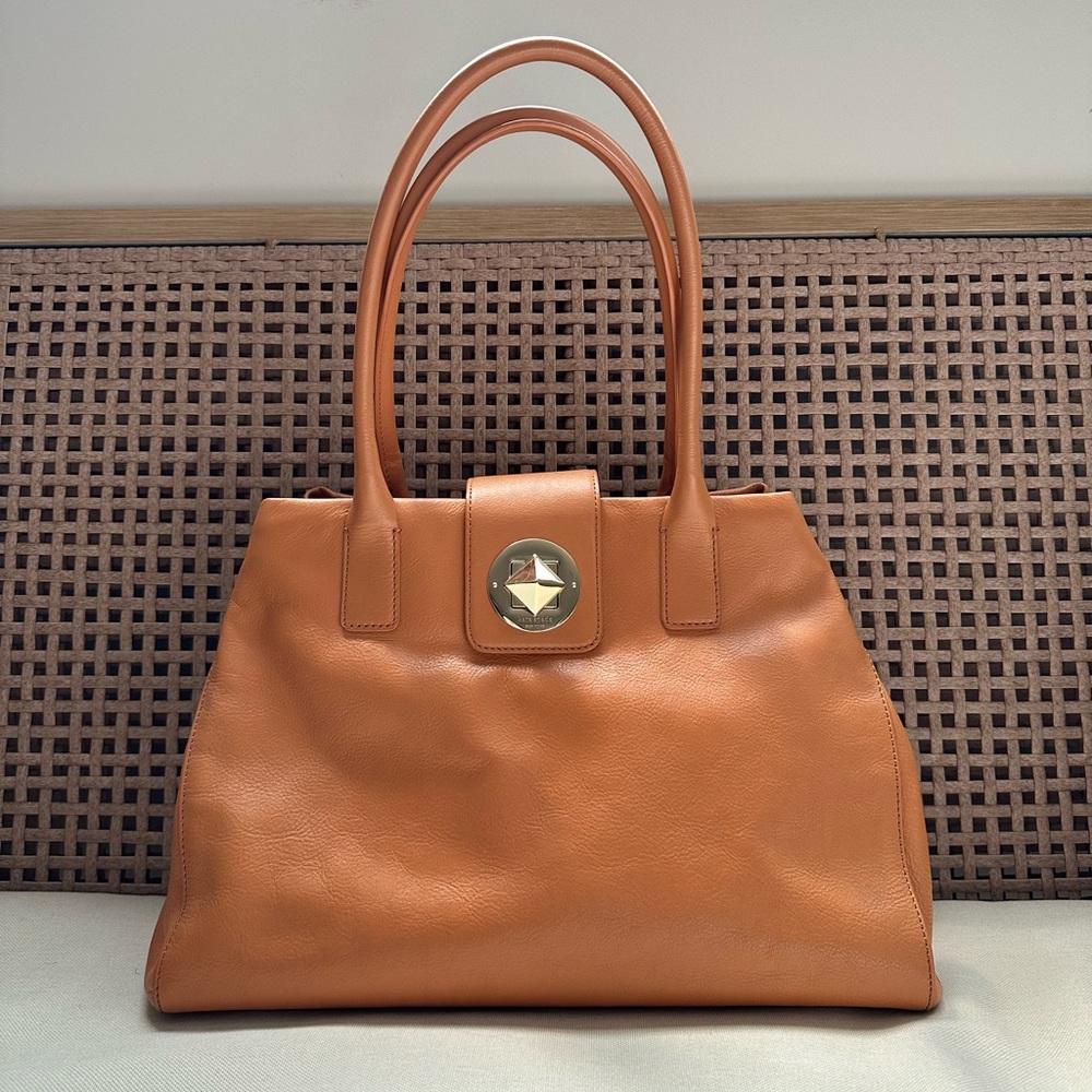 elevate your look! kate spade bag. 100% leather exterior. easily fits a laptop.